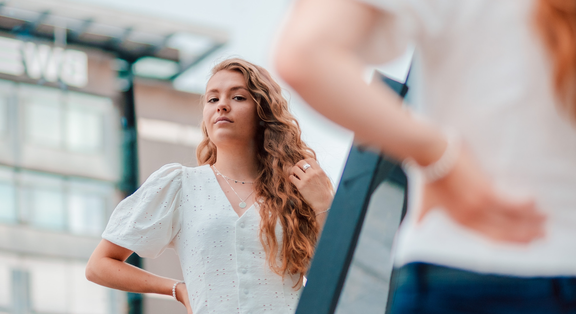 A shopper looking in a mirror while making an emotional buying decision